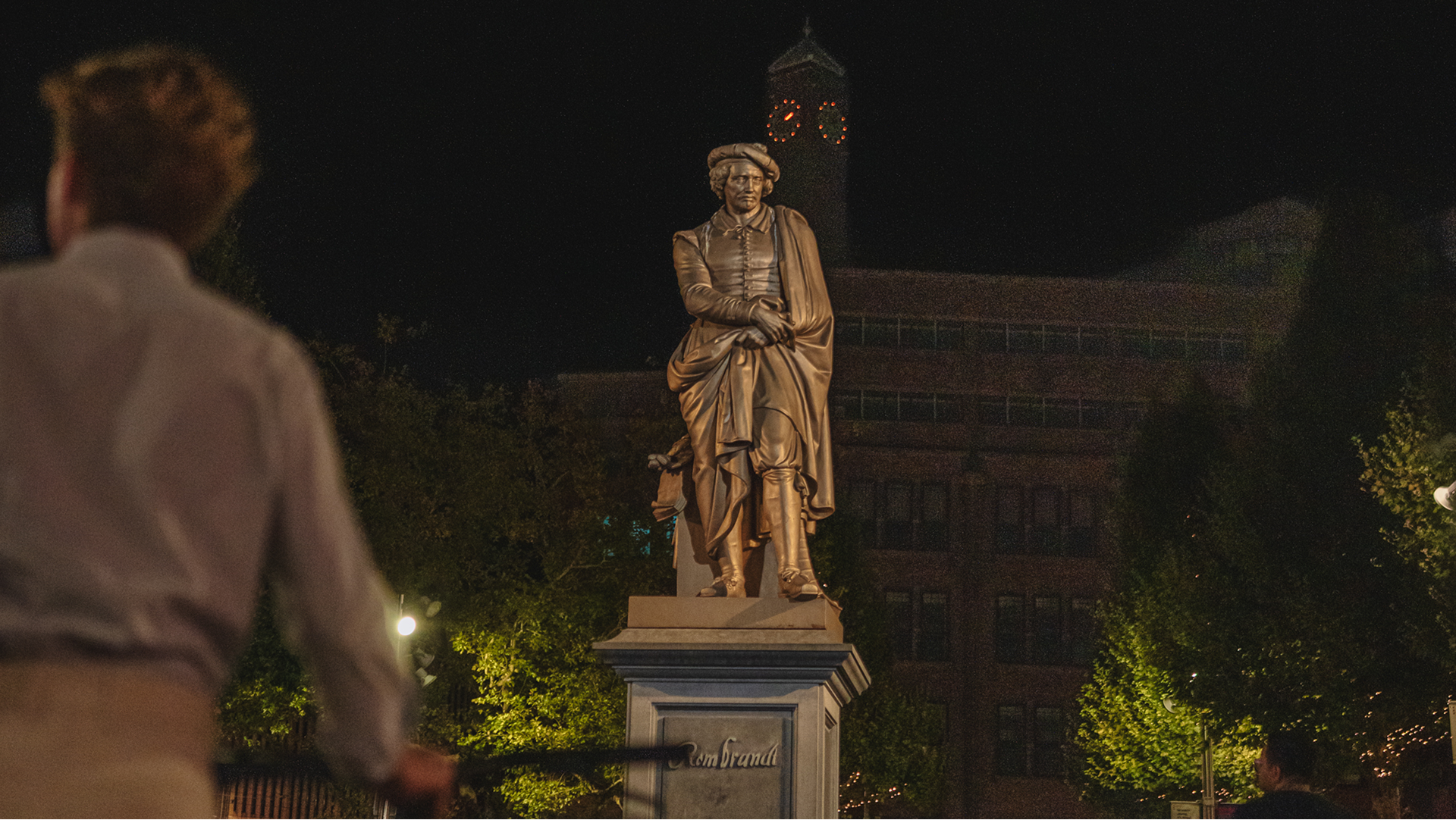 Exterior view of a red brick building at Westergasfabriek in Amsterdam, with large glass windows and traditional architecture