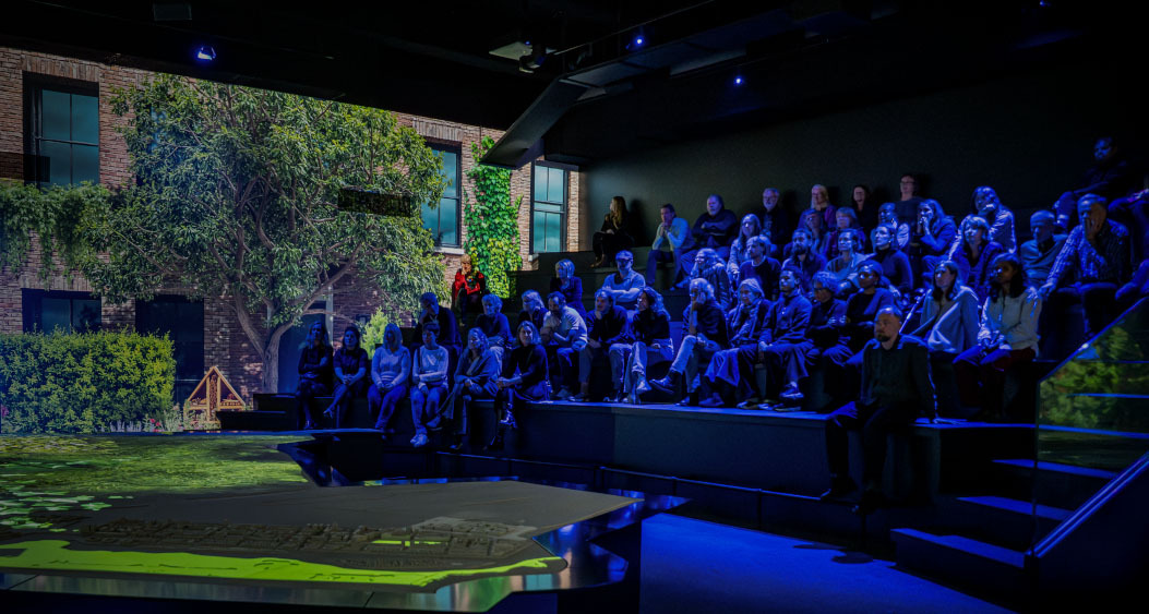 Exterior view of a red brick building at Westergasfabriek in Amsterdam, with large glass windows and traditional architecture